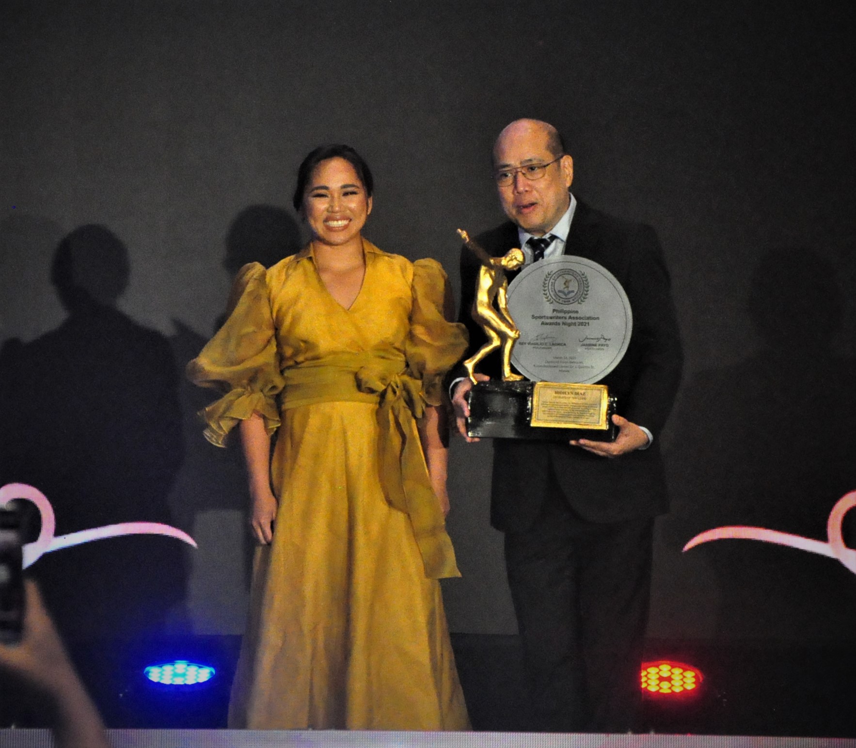 Hidilyn Diaz, the country’s first Olympic gold medalist, receives her Athlete of the Year award from the Philippine Sportswriters Association during the 2022 SMC-PSA Awards night on Monday at Diamond Hotel. CONTRIBUTED PHOTOS/ ANDY SANTOS