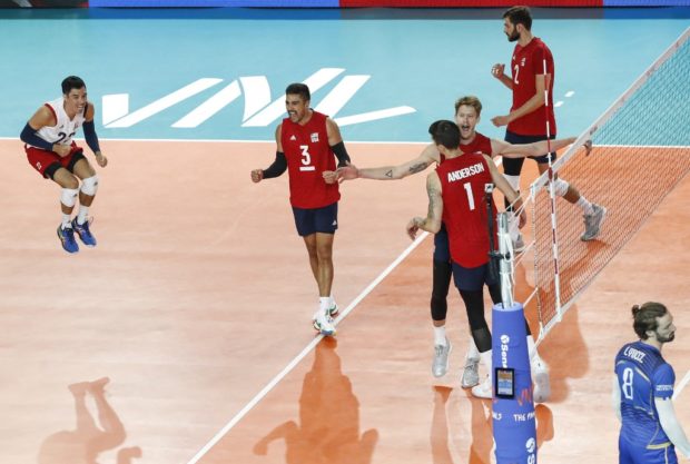 USA players celebrate after defeating France in the FIVB Volleyball Nations League Finals Pool A game in Chicago, Illinois, July 10, 2019.