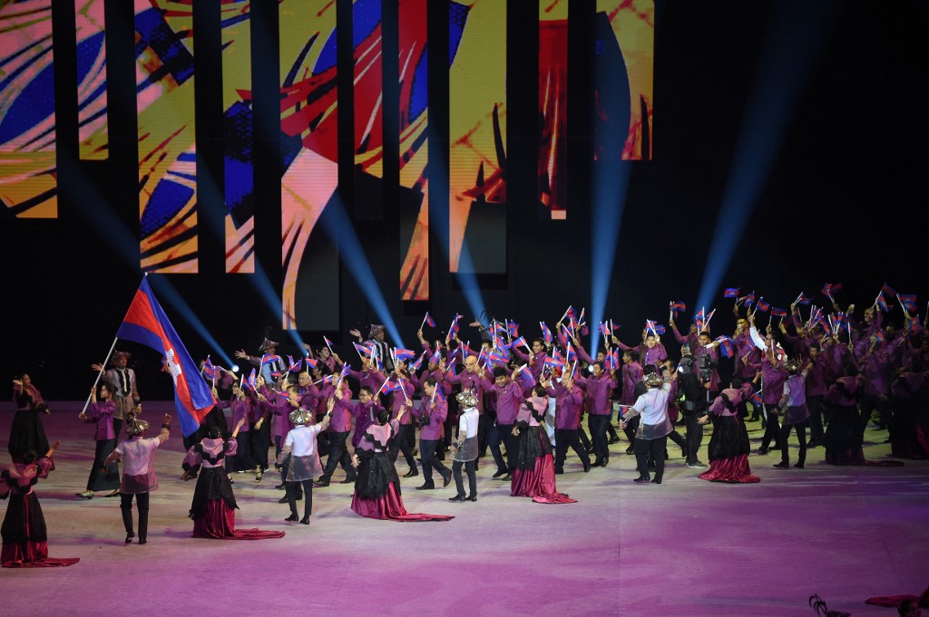 In this photo taken on November 30, 2019, athletes and officials from Cambodia march during the opening ceremony of the SEA Games (Southeast Asian Games) at the Philippine Arena in Bocaue, Bulacan province, north of Manila. 