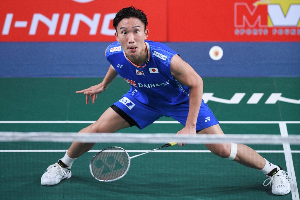 Japan's Kento Momota hits a return against Indonesia's Chico Dwi Wardoyo during their qualifying round men’s singles match at the Badminton Asia Championships in Muntinlupa, suburban Manila on April 27, 2022. 