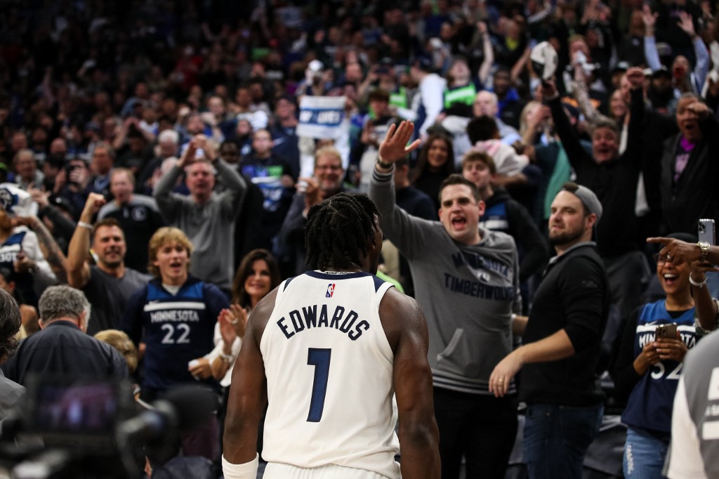 Anthony Edwards #1 of the Minnesota Timberwolves celebrates a 109-104 victory against the Los Angeles Clippers to advance to the NBA Playoffs during a Play-In Tournament game at Target Center on April 12, 2022 in Minneapolis, Minnesota. NOTE TO 