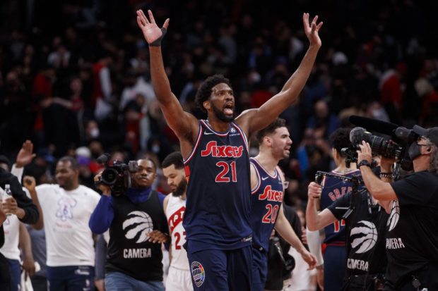 Joel Embiid #21 of the Philadelphia 76ers waves after defeating the Toronto Raptors in Game Three of the Eastern Conference First Round at Scotiabank Arena on April 20, 2022 in Toronto, Canada.