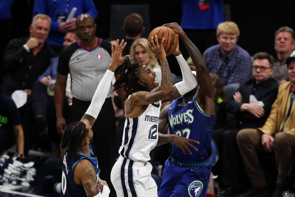 Ja Morant #12 of the Memphis Grizzlies is fouled by Patrick Beverley #22 of the Minnesota Timberwolves in the second quarter during Game Six of the Western Conference First Round at Target Center on April 29, 2022 in Minneapolis, Minnesota. 