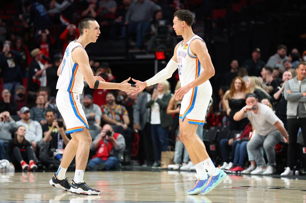 FILE – Isaiah Roby #22 of the Oklahoma City Thunder celebrates with Aleksej Pokusevski #17 after making a three-point basket against the Portland Trail Blazers during the final seconds of play to send the game into overtime at Moda Center on March 28, 2022 in Portland, Oregon.