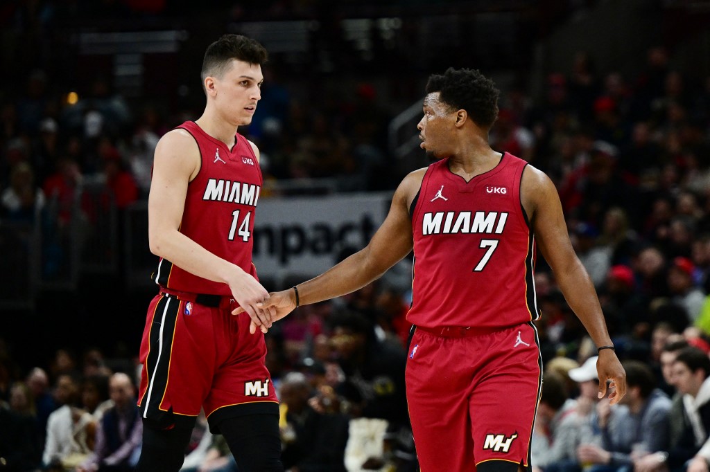 Tyler Herro #14 and Kyle Lowry #7 of the Miami Heat celebrate after scoring in the second half against the Chicago Bulls at United Center on April 02, 2022 in Chicago, Illinois. NOTE 