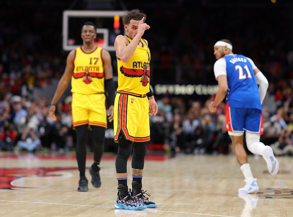 Trae Young #11 of the Atlanta Hawks reacts after hitting a three-point basket against the Washington Wizards during the second half at State Farm Arena on April 06, 2022 in Atlanta, Georgia