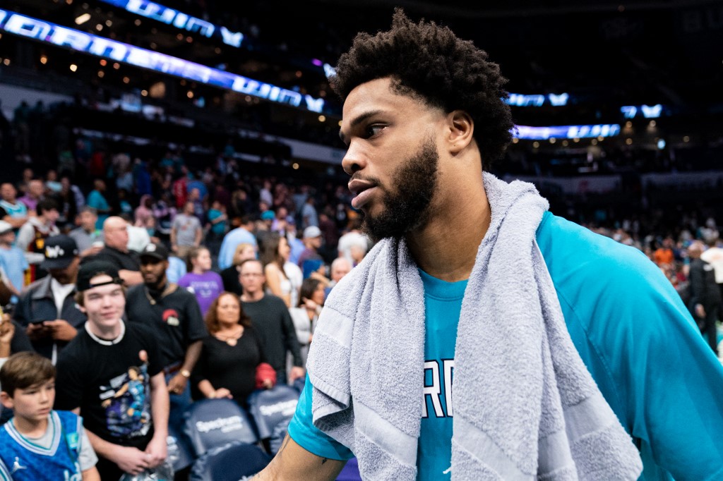 FILE–Miles Bridges #0 of the Charlotte Hornets walks off the court after defeating the Orlando Magic during their game at Spectrum Center on April 07, 2022 in