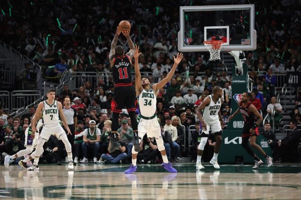 DeMar DeRozan #11 of the Chicago Bulls shoots over Giannis Antetokounmpo #34 of the Milwaukee Bucks during the second half of Game Two of the Eastern Conference First Round Playoffs at Fiserv Forum on April 20, 2022 in Milwaukee, Wisconsin. 