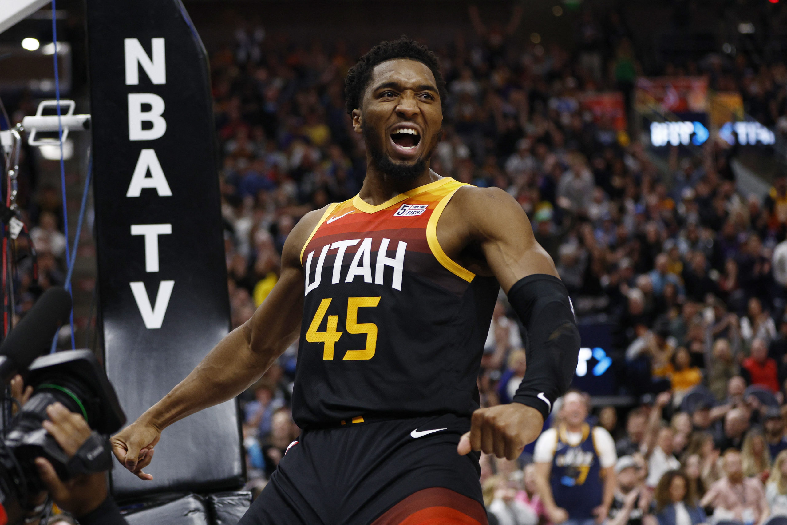 Utah Jazz guard Donovan Mitchell (45) reacts after dunking the ball in the fourth quarter against the Los Angeles Lakers at Vivint Arena.