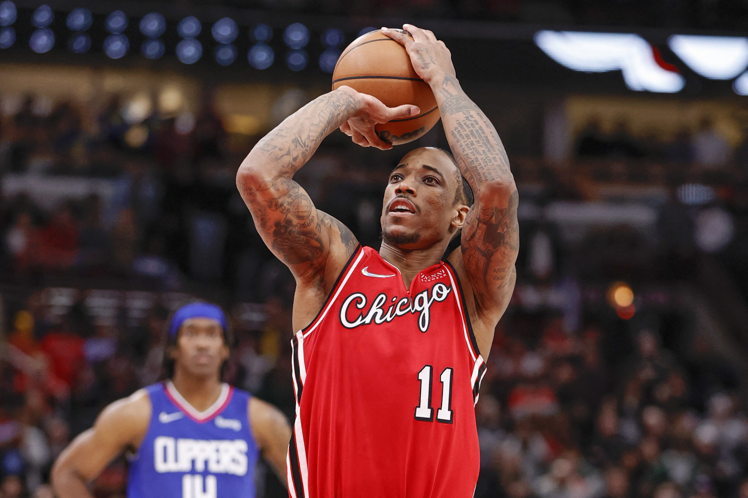 Chicago Bulls forward DeMar DeRozan (11) shoots a free throw against the LA Clippers during the second half at United Center. 