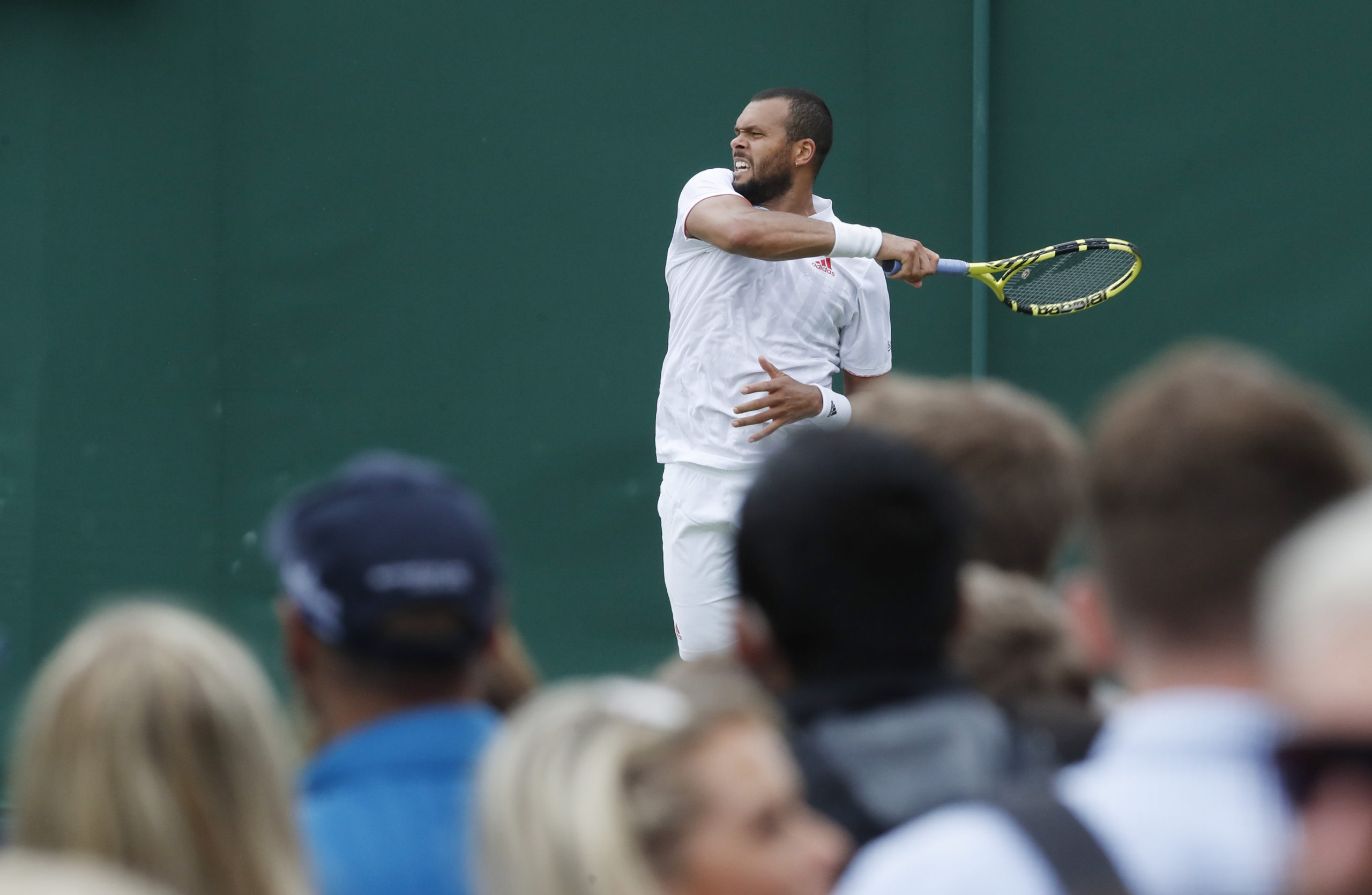 Tennis - Wimbledon - All England Lawn Tennis and Croquet Club, London, Britain - June 30, 2021 France's Jo-Wilfried Tsonga in action during his first round match against Sweden's Mikael Ymer 