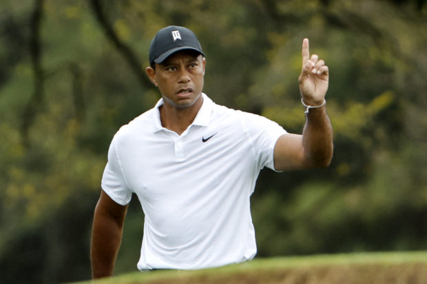 The Masters - Augusta National Golf Club - Augusta, Georgia, U.S. - April 6, 2022 Tiger Woods of the U.S. reacts after his shot on the 18th during a practice round REUTERS/Jonathan Ernst