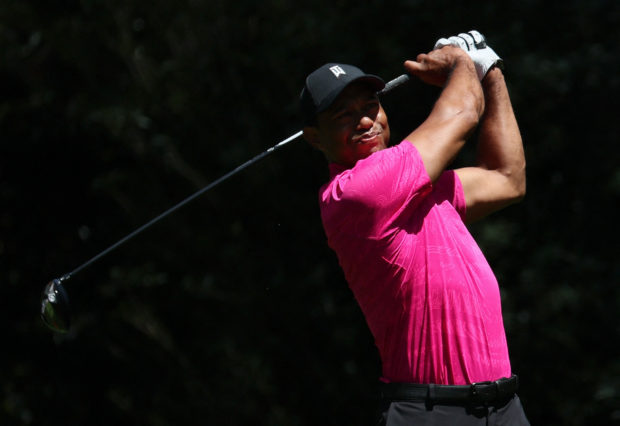 Tiger Woods of the U.S. tees off on the 11th during the first round REUTERS/Mike Segar
