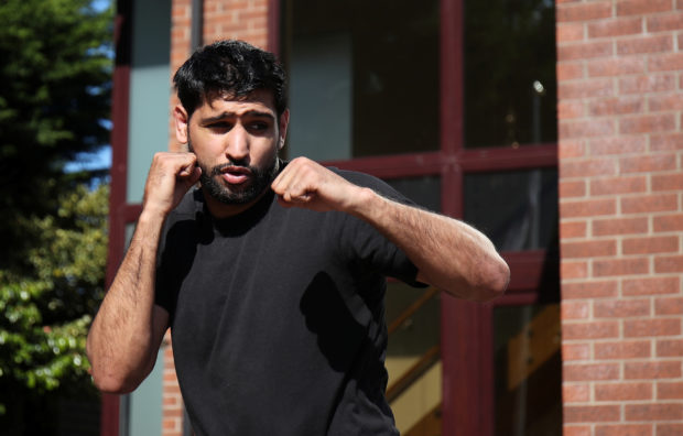 FILE PHOTO: Boxer Amir Khan trains at his home in Bolton, following the outbreak of the coronavirus disease (COVID-19), Bolton, Britain, May 20, 2020. REUTERS/Molly 