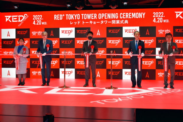 Attendees at the opening ceremony of the Red Tokyo Tower esports park cut the ribbon, in Tokyo, Japan April 20, 2022. 