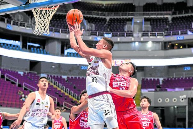 Zavier Lucero (left) powers UP to a victory that clinched twice-to-beat protection in the Final Four. —UAAP MEDIA