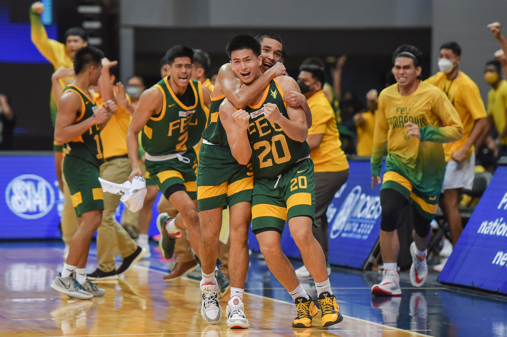 FEU celebrates Xyrus Torres' game-winning three in a crucial victory vs NU. UAAP PHOTO