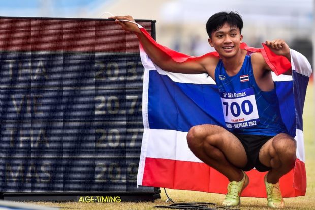 Thailand's Puripol Boonson celebrates with his time after winning the gold medal in the men's 200m race during the athletics events at the 31st Southeast Asian Games (SEA Games) in Hanoi on May 14, 2022. (Photo by Ye Aung Thu / AFP)