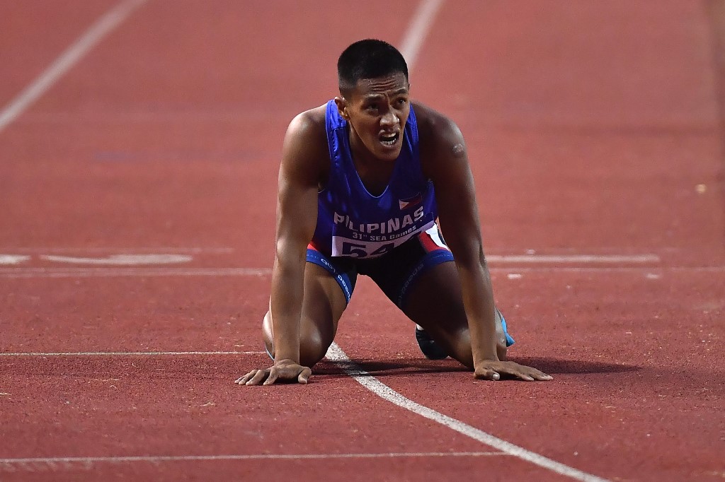 Philippines' Aries Toledo Banes reacts after winning the men's 1500m decathlon final during the 31st Southeast Asian Games (SEA Games) at My Dinh National Stadium in Hanoi on May 15, 2022. (Photo by Ye Aung Thu / AFP)