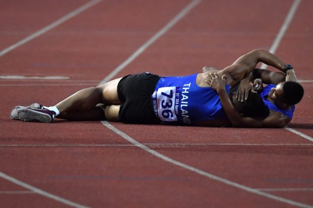 e ground after finishing the men's 1500m decathlon final during the 31st Southeast Asian Games (SEA Games) at My Dinh National Stadium in Hanoi on May 15, 2022.