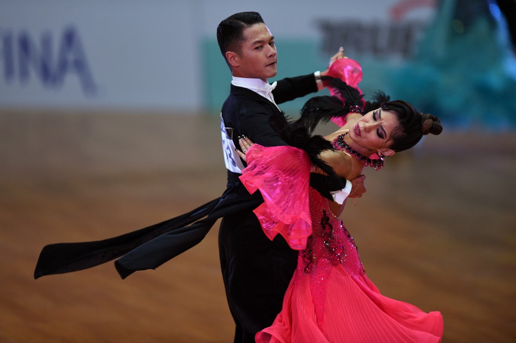 Philippines' Sean Mischa Aranar (top) and Nualla Ana Leonila Manalo compete in the dancesport event during the 31st Southeast Asian Games (SEA Games) in Hanoi on May 16, 2022. (Photo by Nhac NGUYEN / AFP)