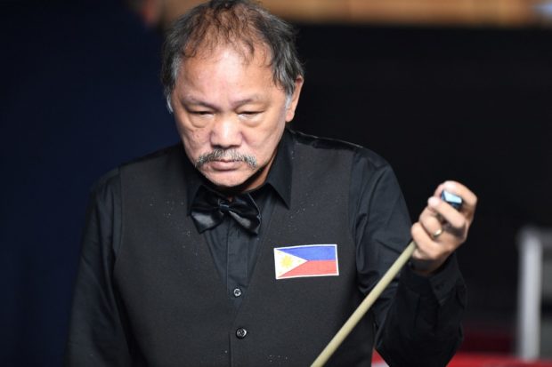 Philippines' Efren Reyes competes against Vietnam's Tran Quyet Chien in men's billiards 3-cushion event during the 31st Southeast Asian Games (SEA Games) at the Ha Dong Gymnasium in Hanoi on May 19, 2022. (Photo by Nhac NGUYEN / AFP) / “ The erroneous mention[s] appearing in the metadata of this photo by Nhac NGUYEN has been modified in AFP systems in the following manner: [Ha Dong Gymnasium] instead of [Quan Ngura Sports Complex].  Please immediately remove the erroneous mention[s] from all your online services and delete it (them) from your servers.  If you have been authorized by AFP to distribute it (them) to third parties, please ensure that the same actions are carried out by them.  Failure to promptly comply with these instructions will entail liability on your part for any continued or post notification usage.  Therefore we thank you very much for all your attention and prompt action.  We are sorry for the inconvenience of this notification may cause and remain at your disposal for any further information you may require.”
