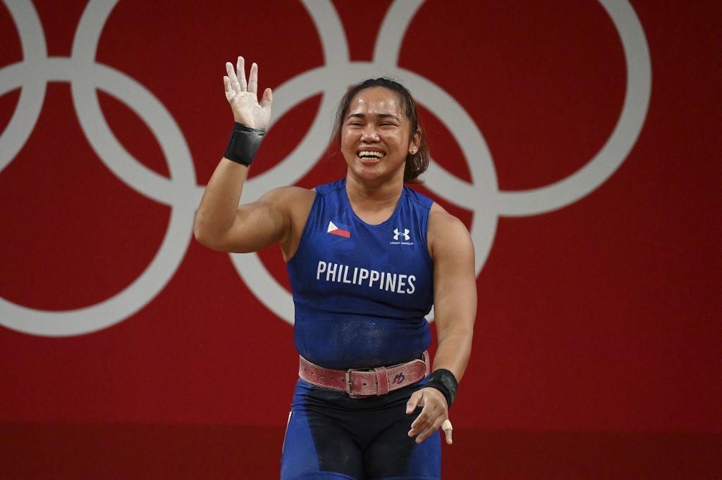 Philippines' Hidilyn Diaz gestures during the women's 55kg weightlifting competition during the Tokyo 2020 Olympic Games at the Tokyo International Forum in Tokyo on July 26, 2021