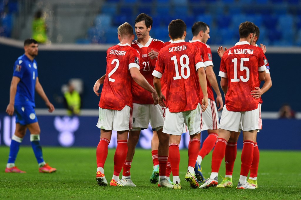 Russia's players celebrate after the FIFA World Cup Qatar 2022 qualification football match between Russia and Cyprus in Saint Petersburg on November 11, 2021.