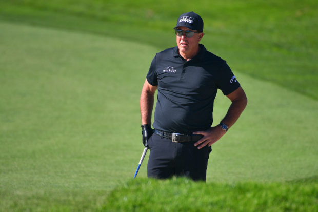 Phil Mickelson stands on the 11th hole during the second round of The Farmers Insurance Open on the North Course at Torrey Pines Golf Course on January 27, 2022 in La Jolla, California.   Donald Miralle/Getty Images/AFP (Photo by DONALD MIRALLE / GETTY IMAGES NORTH AMERICA / Getty Images via AFP)
