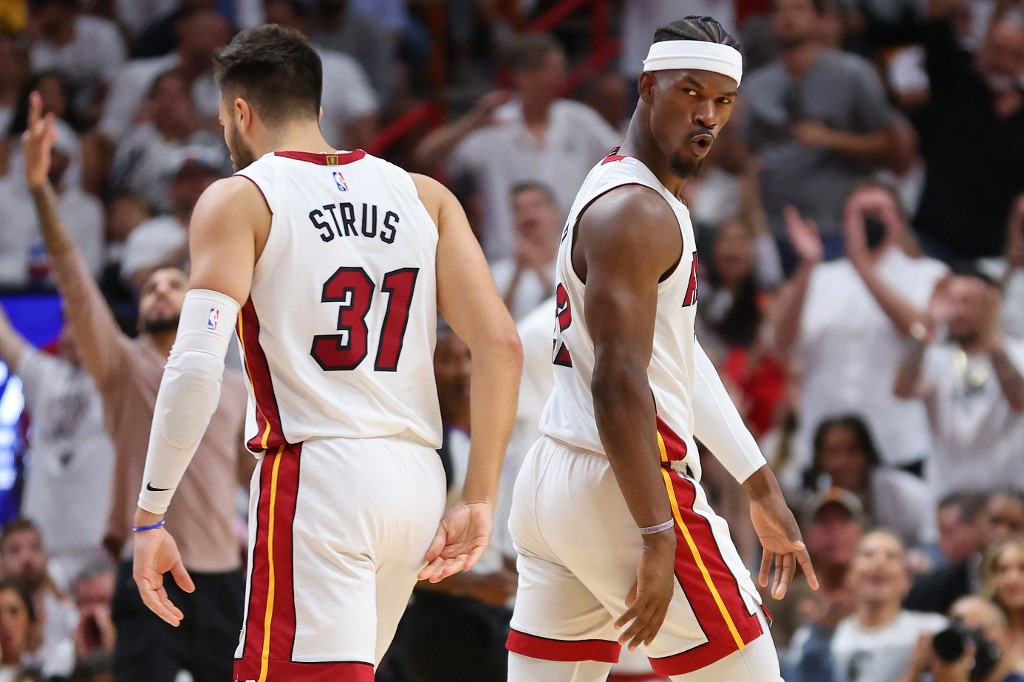 y Butler #22 of the Miami Heat celebrates a three pointer with Max Strus #31 against the Philadelphia 76ers during the second half in Game Five of the Eastern Conference Semifinals at FTX Arena on May 10, 2022 in Miami, Florida.