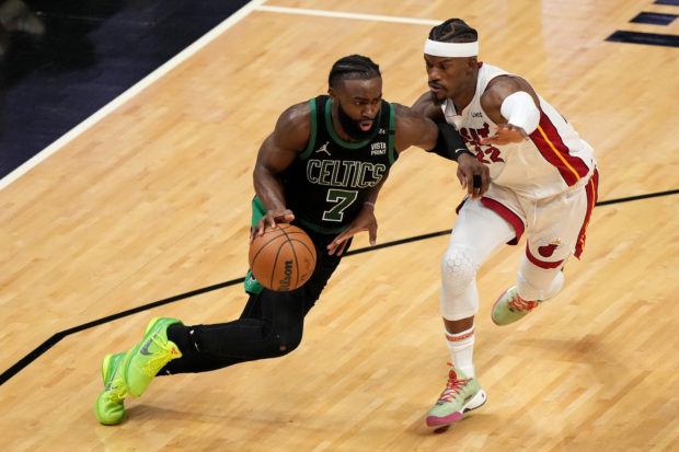 Jaylen Brown #7 of the Boston Celtics is defended by Jimmy Butler #22 of the Miami Heat during the third quarter in Game Five of the 2022 NBA Playoffs Eastern Conference Finals at FTX Arena on May 25, 2022 in Miami, Florida. NOTE TO USER: User expressly acknowledges and agrees that, by downloading and or using this photograph, User is consenting to the terms and conditions of the Getty Images License Agreement. Eric Espada/Getty Images/AFP (Photo by Eric Espada / GETTY IMAGES NORTH AMERICA / Getty Images via AFP)