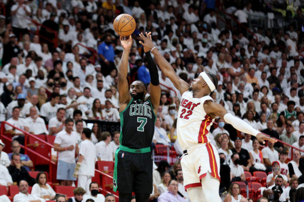 Jaylen Brown #7 of the Boston Celtics shoots the ball against Jimmy Butler #22 of the Miami Heat during the fourth quarter in Game Five of the 2022 NBA Playoffs Eastern Conference Finals at FTX Arena on May 25, 2022 in Miami, Florida. NOTE TO USER: User expressly acknowledges and agrees that, by downloading and or using this photograph, User is consenting to the terms and conditions of the Getty Images License Agreement. Andy Lyons/Getty Images/AFP (Photo by ANDY LYONS / GETTY IMAGES NORTH AMERICA / Getty Images via AFP)