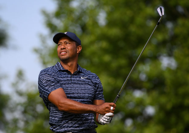Tiger Woods plays his shot on the 14th tee during the first round of the PGA Championship golf tournament. Mandatory Credit: Orlando Ramirez-USA TODAY Sports