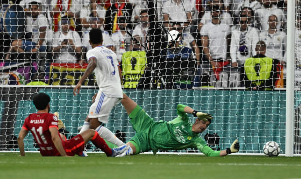 Soccer Football - Champions League Final - Liverpool v Real Madrid - Stade de France, Saint-Denis near Paris, France - May 28, 2022 Real Madrid's Thibaut Courtois saves a shot from Liverpool's Mohamed Salah REUTERS/Dylan Martinez