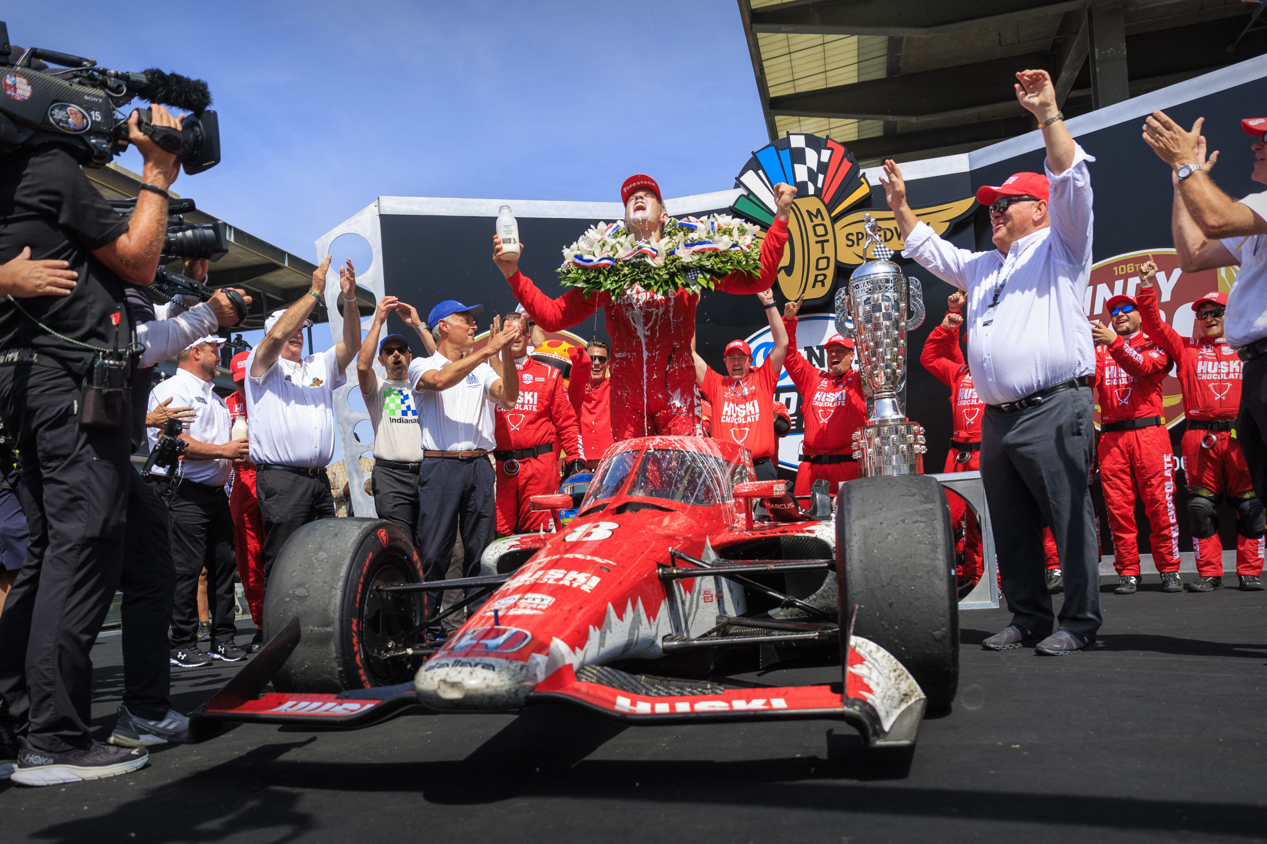 May 29, 2022; Indianapolis, Indiana, USA; Chip Ganassi Racing driver Marcus Ericsson (8) of Sweden celebrates in victory lane with milk after he wins the 106th Indianapolis 500 at Indianapolis Motor Speedway. Mandatory Credit: Mark J. Rebilas-USA TODAY Sports