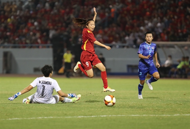 An amazing effort from captain Huỳnh Như (9) beat Thailand's goalkeeper Waraporn and sealed the title for the hosts. — VNA/VNS Photo Hoàng Linh via ANN
