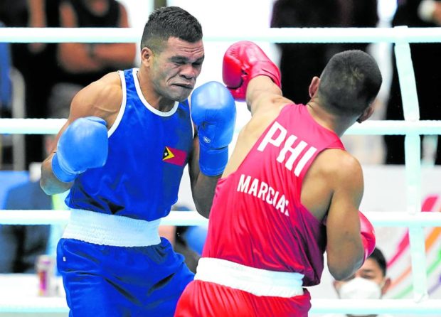 Eumir Marcial batters Timor-Leste’s Delio Mouzinho on the way to a gold medal in boxing’s middleweight class. 