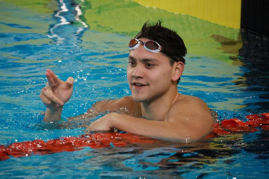 Joseph Schooling celebrating after winning the men's 100m butterfly in the Hanoi SEA Games on May 16, 2022. PHOTO: LIANHE ZAOBAO (STRAITS TIMES VIA ANN)