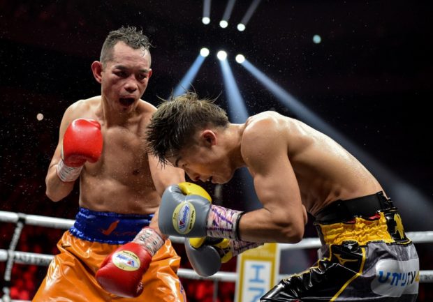 Naoya Inoue of Japan (R) and Nonito Donaire of Philippines (L) fight in their World Boxing Super Series bantamweight final at Saitama Super Arena in Saitama on November 7, 2019. (Photo by Kazuhiro NOGI / AFP)