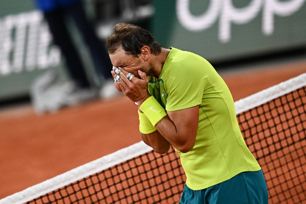 Spain's Rafael Nadal reacts after winning against Serbia's Novak Djokovic at the end of their men's singles match on day ten of the Roland-Garros Open tennis tournament at the Court Philippe-Chatrier in Paris early June 1, 2022. (Photo by Christophe ARCHAMBAULT / AFP)