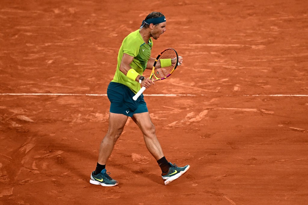 Spain's Rafael Nadal reacts as he plays against Germany's Alexander Zverev during their men's semi-final match on day 13 of the Roland-Garros Open tennis tournament at the Court Philippe-Chatrier in Paris on June 3, 2022. (Photo by Anne-Christine POUJOULAT / AFP)