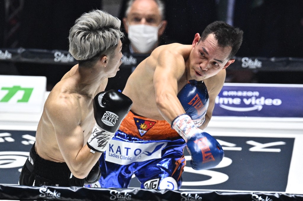Japan's Naoya Inoue (L) fights against Philippines' Nonito Donaire during their Bantamweight unification boxing match at Saitama Super Arena in Saitama on June 7, 2022. (Photo by Philip FONG / AFP)