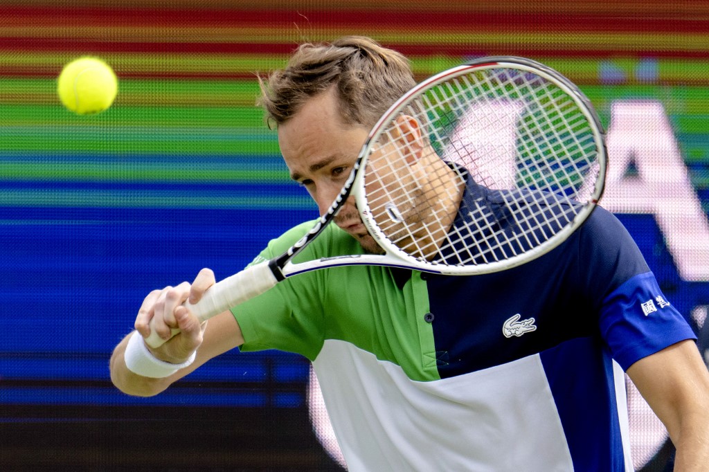 Russia's Daniil Medvedev hits a return to France's Gilles Simon during their Libema Open tennis match in Rosmalen, on June 9, 2022. (Photo by Sander Koning / ANP / AFP) / Netherlands OUT