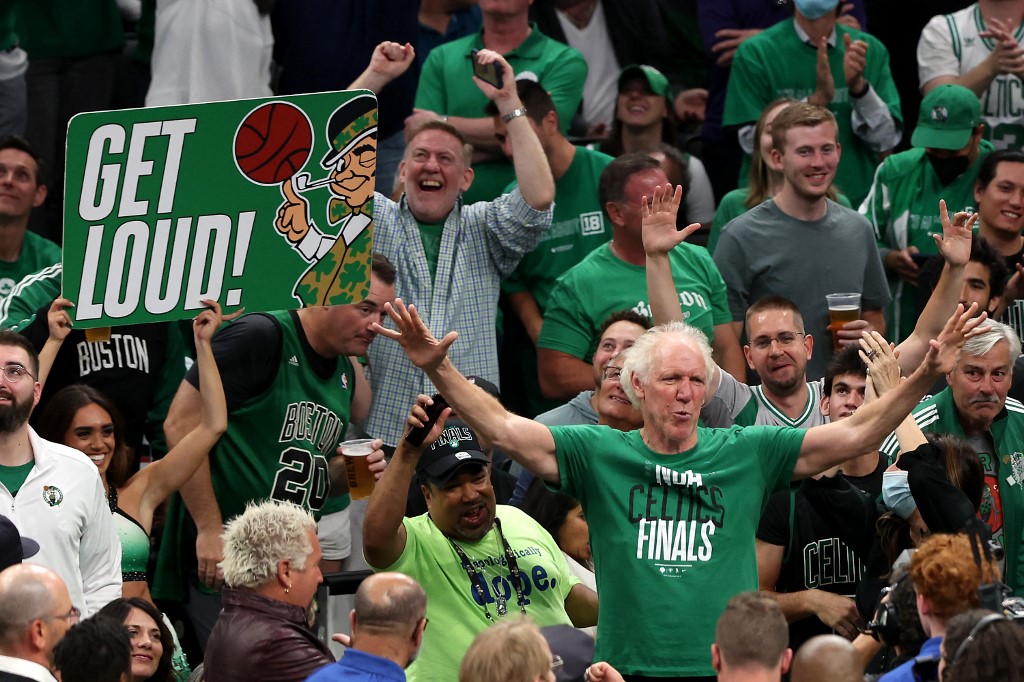 Former Boston Celtics player Bill Walton cheers with fans in the third quarter during Game Three of the 2022 NBA Finals against the Golden State Warriors at TD Garden on June 08, 2022 in Boston, Massachusetts
