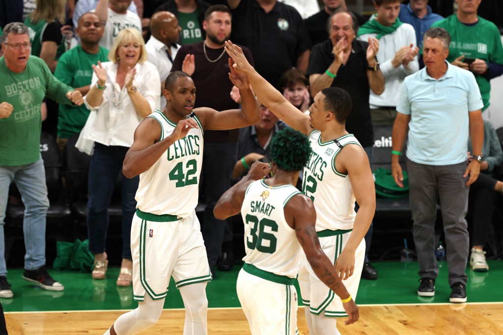 Al Horford #42 of the Boston Celtics reacts after a play with teammates Marcus Smart #36 and Grant Williams