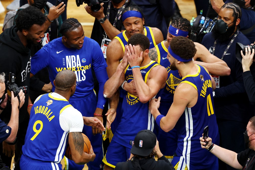 Stephen Curry #30 of the Golden State Warriors celebrates with teammates after defeating the Boston Celtics in Game Six of the 2022 NBA Finals at TD Garden