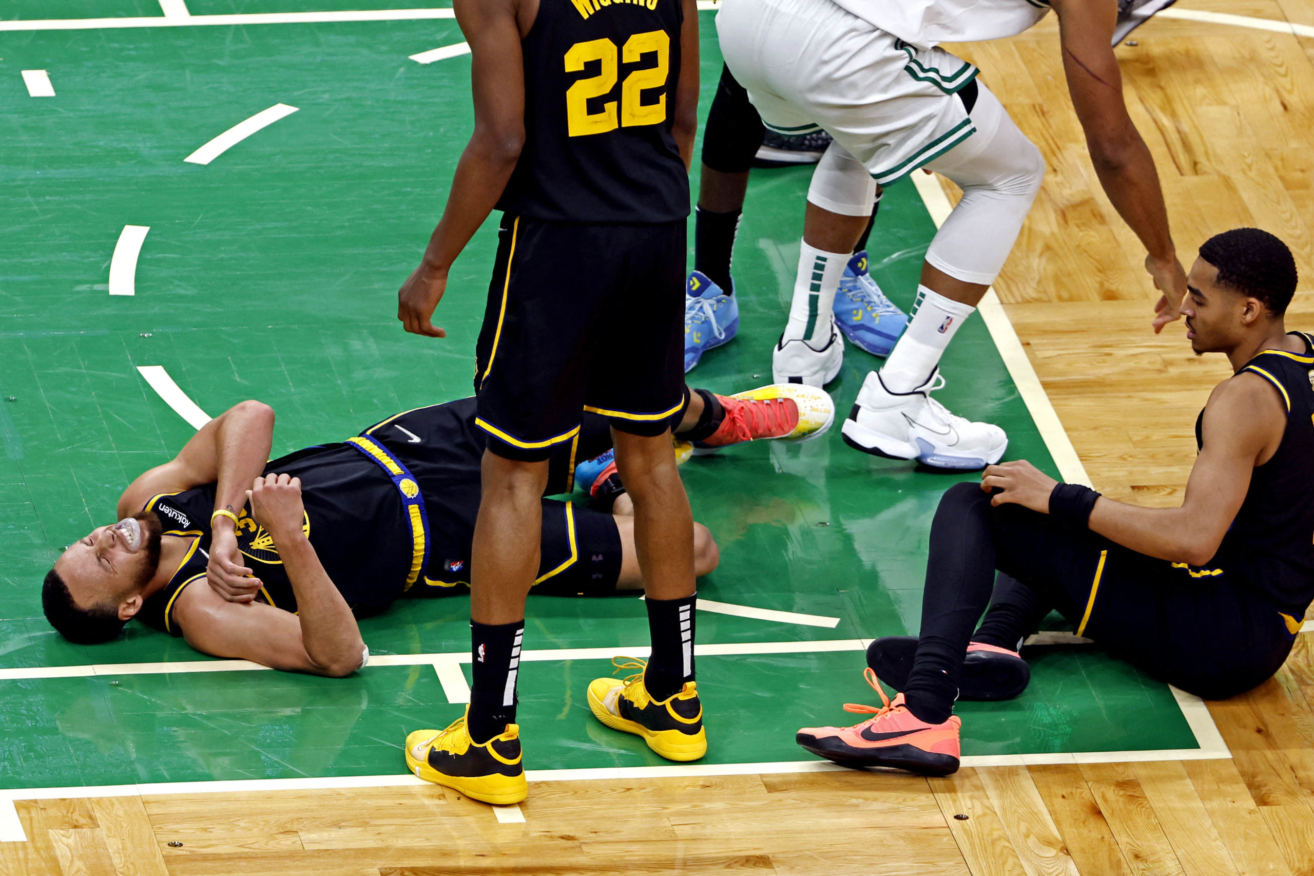 Jun 8, 2022; Boston, Massachusetts, USA; Golden State Warriors guard Stephen Curry (30) reacts to an apparent injury during the fourth quarter against the Boston Celtics in game three of the 2022 NBA Finals at TD Garden. Mandatory Credit: Winslow Townson-USA TODAY Sports