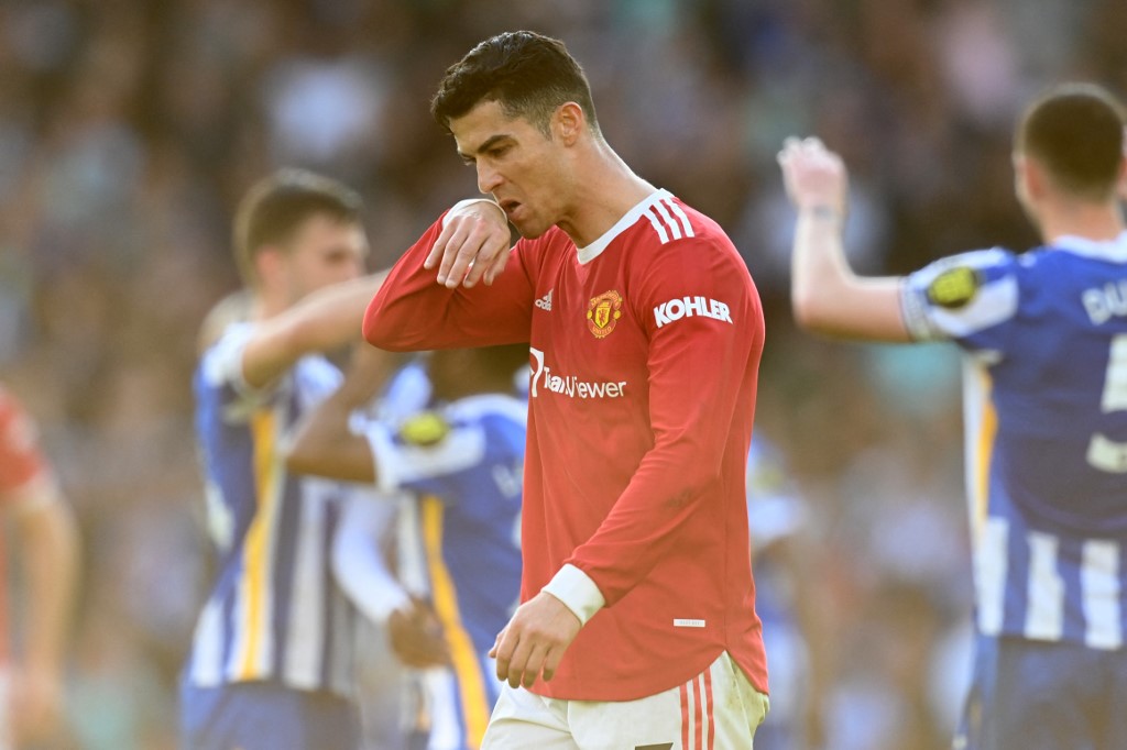 Manchester United's Portuguese striker Cristiano Ronaldo reacts on the pitch after the English Premier League football match between Brighton and Hove Albion and Manchester United at the American Express Community Stadium in Brighton, southern England on May 7, 2022