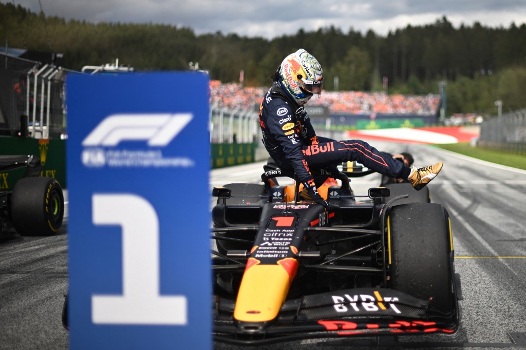 Red Bull Racing's Dutch driver Max Verstappen climbs out of his car after winning the sprint qualifying at the Red Bull Ring race track in Spielberg, Austria, on July 9, 2022, ahead of the Formula One Austrian Grand Prix.