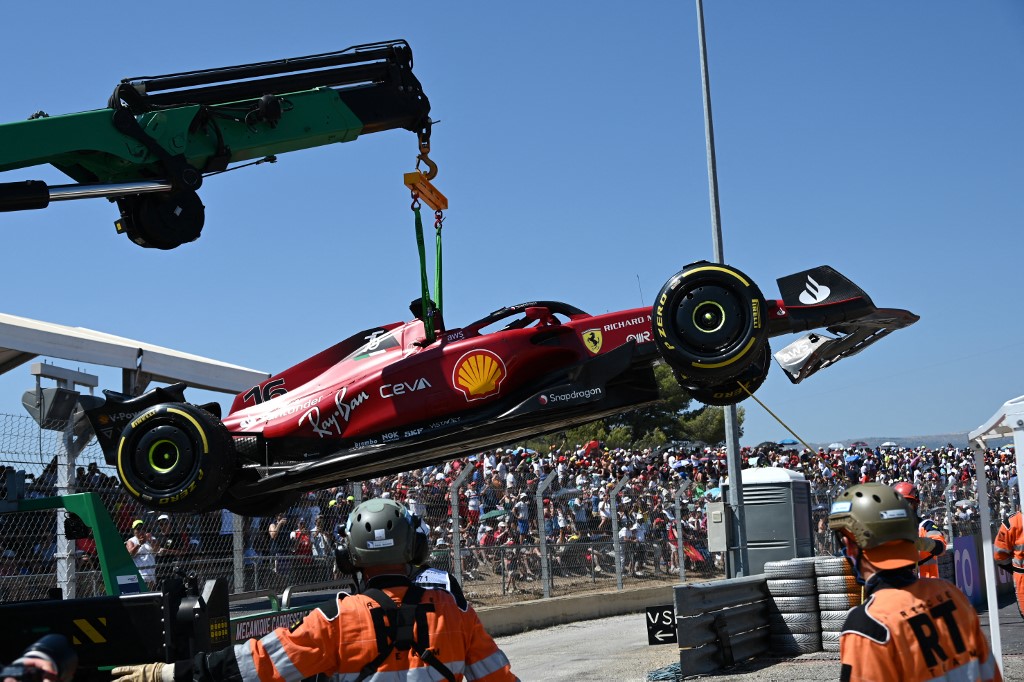 The car of Ferrari's Monegasque driver Charles Leclerc is evacuated after he crashed during the French Formula One Grand Prix at the Circuit Paul-Ricard in Le Castellet, southern France, on July 24, 2022. 
